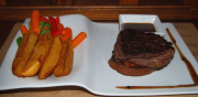 Beef steak with black pepper sauce, steamed vegetables, pan fried potato