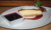 New York cheesecake served with cranberry sauce