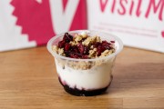 Greek yogurt with blueberry jam, granola crunch and cranberries
