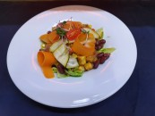 Vegan salad mix with smoked tofu and citrus sauce