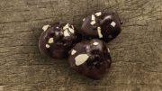 Filled chocolate ball with caramel and almond
