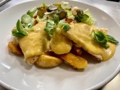 Baked chicken breast with cheddar cheese sauce