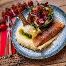 Grilled salmon steak with parmesan mashed potatoes, fresh salad with raspberry vinegar
