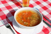 Chicken broth with its meat, with soup pasta and vegetables
